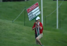 Watch Poor Sign Boy Blowing in the Wind at Senior PGA Championship
