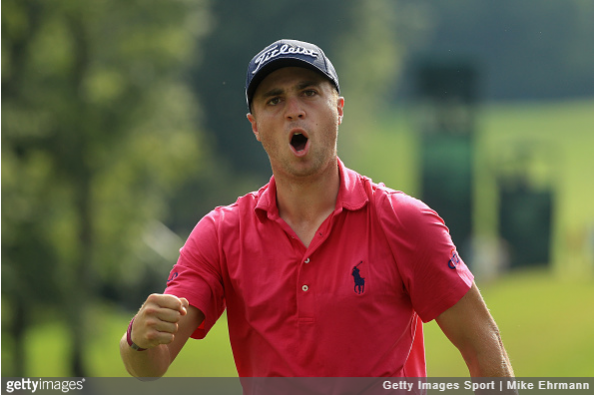 Justin Thomas reacts after a chip-in birdie on 13.